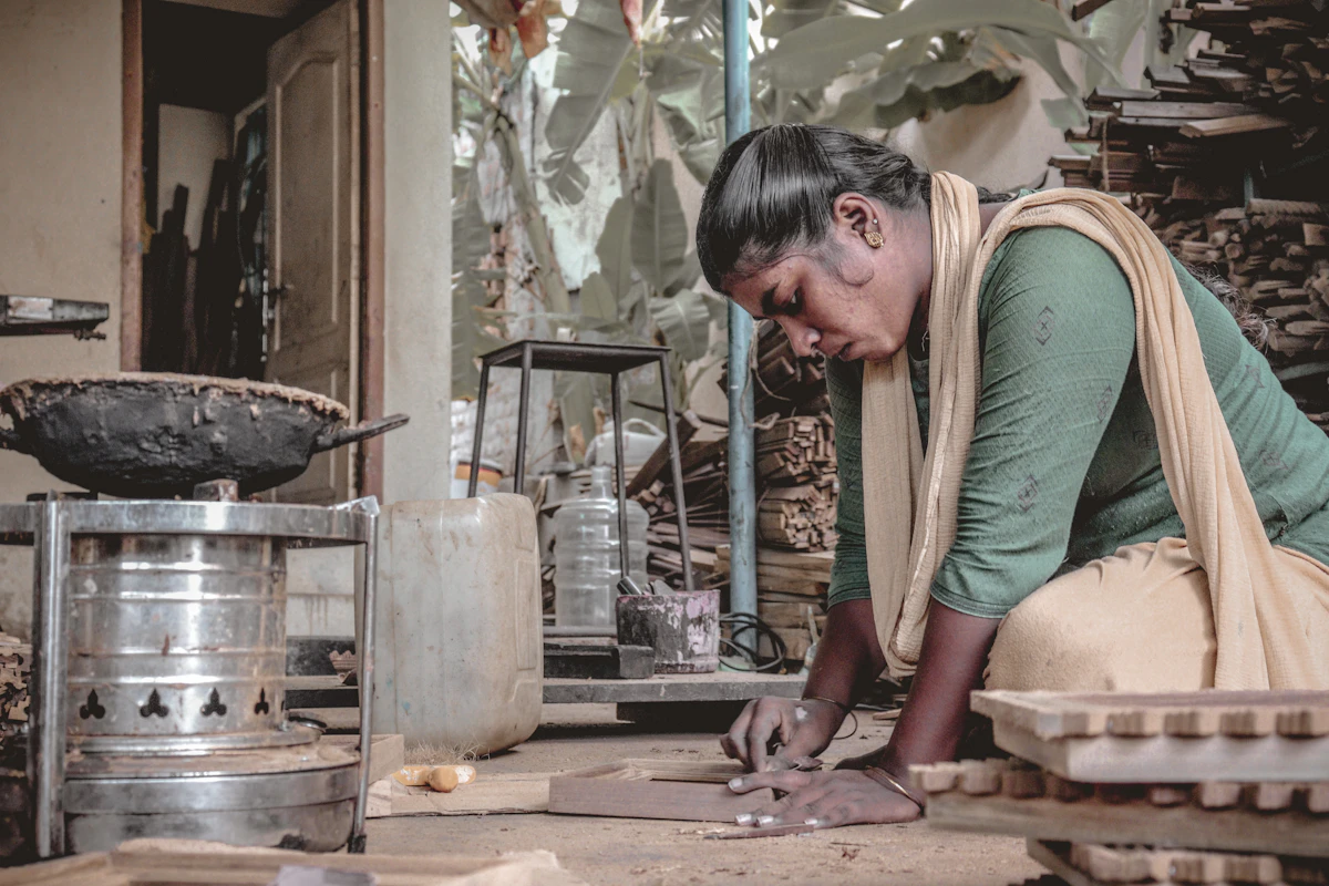 Woman entrepreneur working on artisan pottery in her production workshop