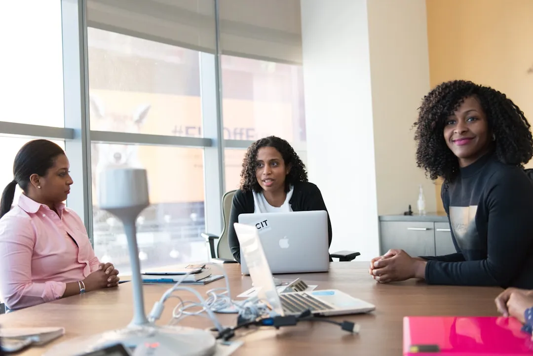 Black woman entrepreneur meeting with an advisor at a community business center